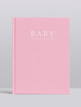 A pink Write To Me Baby Journal - Birth To Five Years - Grey / Oatmeal / Pink / Blue with the word baby on it.