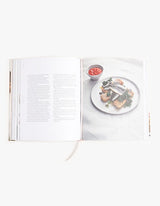 An open book with a picture of a plate of food showcasing THE BEAUTY CHEF GUT GUIDE from Books.