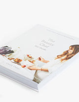 A THE BEAUTY CHEF GUT GUIDE book with a woman's face on it that focuses on gut health.