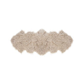A luxurious Flux Home Tibetan lamb fur double rug on a white background.