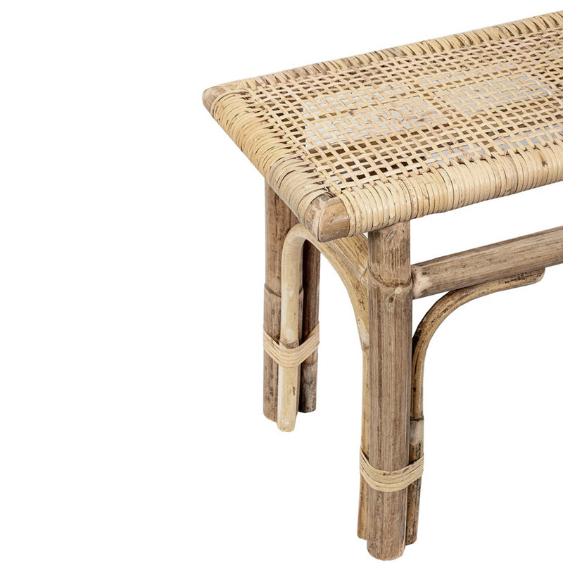 A Flux Home rattan bench with a woven top.