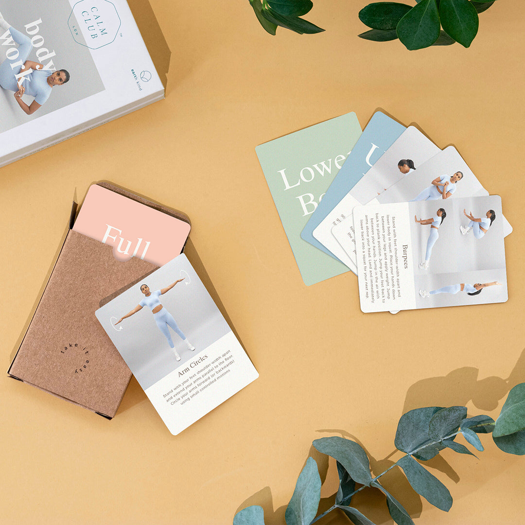 Body Work box with cards spread out and a sprig of eucalyptus