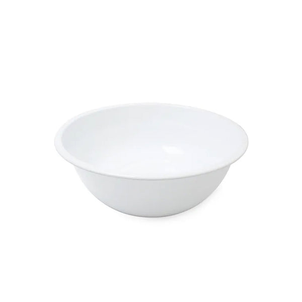 A white Falcon enamel noodle bowl on a white surface.