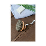 A Florence DRY MASSAGE BRUSH with sage and soap on a wooden table.