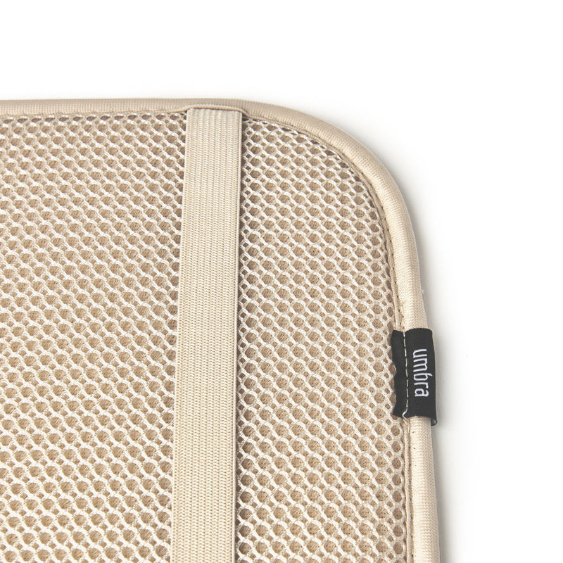 A functional Udry Drying Mat Mini with a zipper by Umbra.