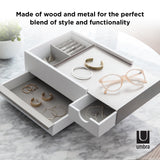 An Umbra STOWIT JEWELRY BOX WHT/NKL with a pair of glasses and a pair of earrings. This storage container is perfect for organizing your precious accessories.