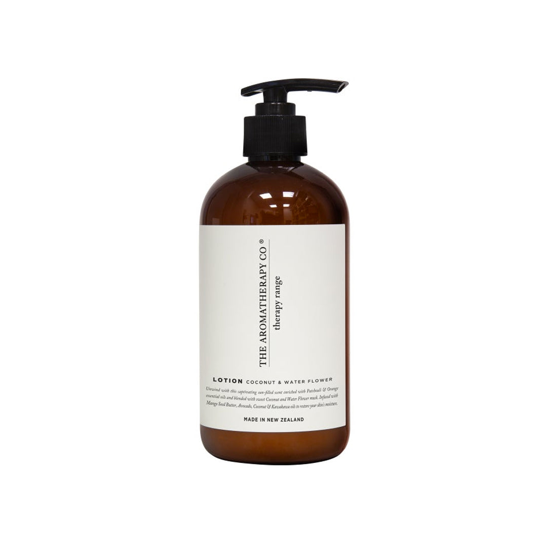 Therapy Unwind Coconut & Water Flower hand and body lotion in an amber bottle with a white label, on white