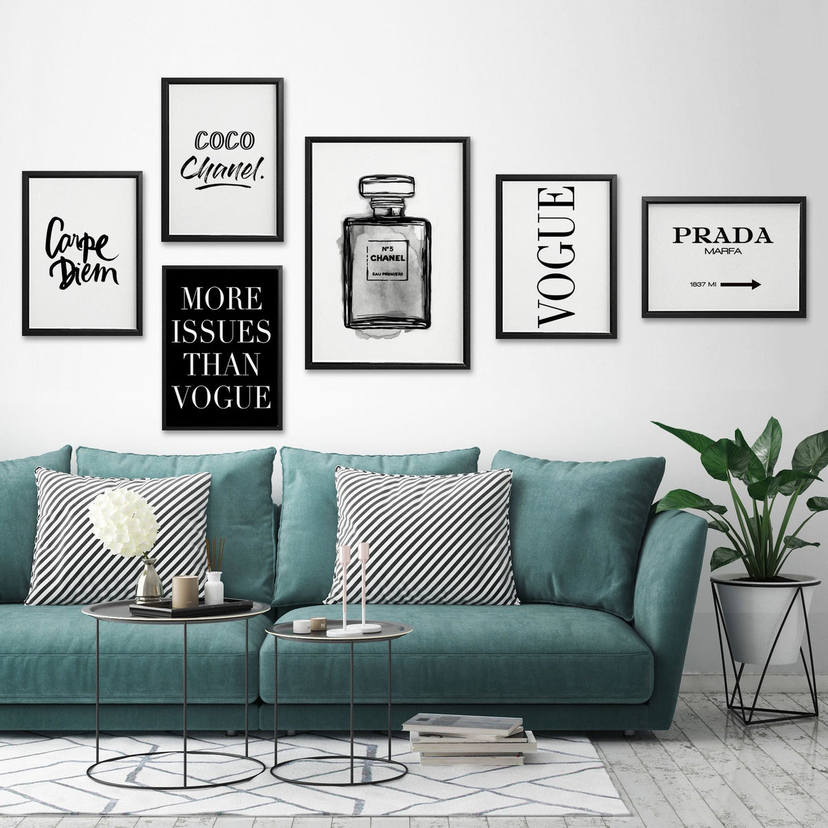 Gallery wall of framed typographic prints, including Carpe Diem, above a teal sofa