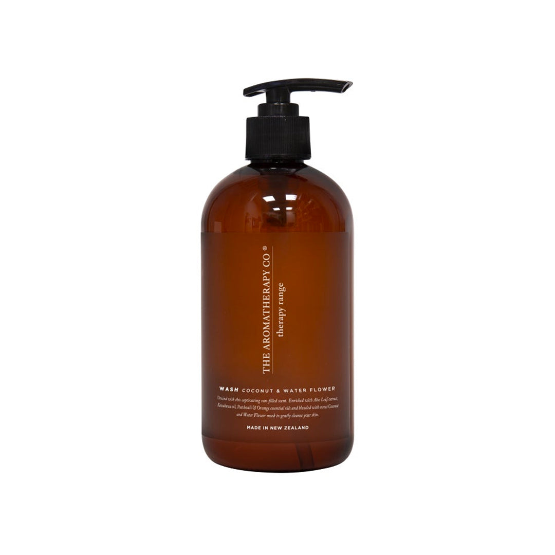 Therapy hand and body wash in an amber pump bottle, labelled Coconut & Water Flower, on white