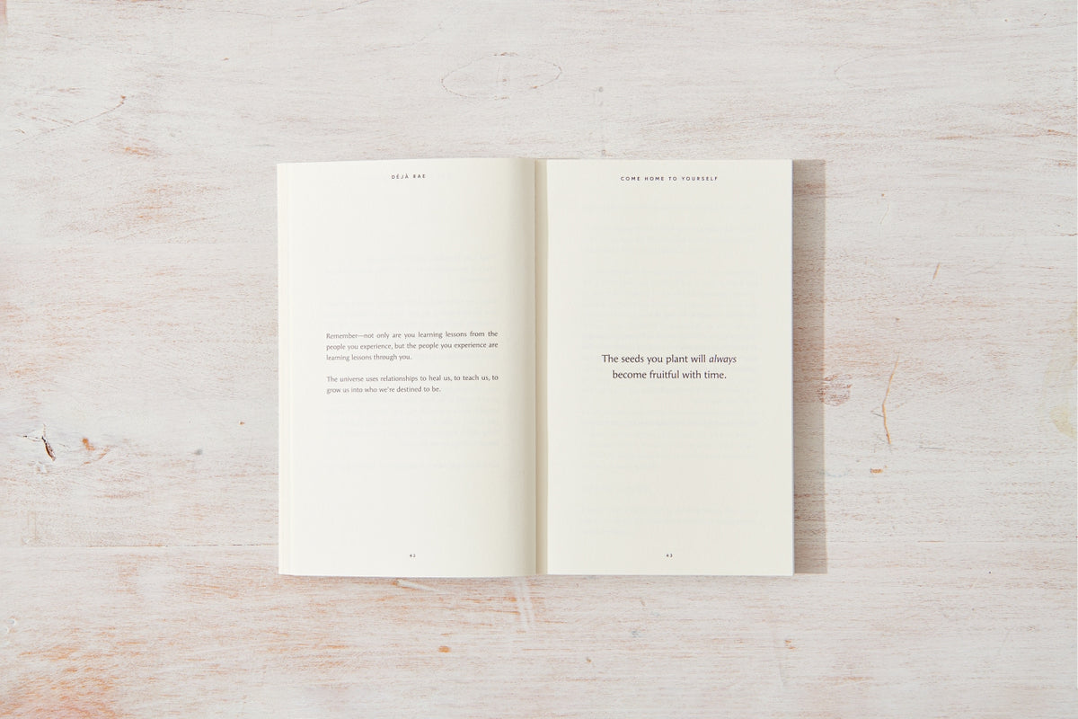 An "Come Home to Yourself | Déjà Rae" open book with a quote on it that explores the themes of solitude and relationships.