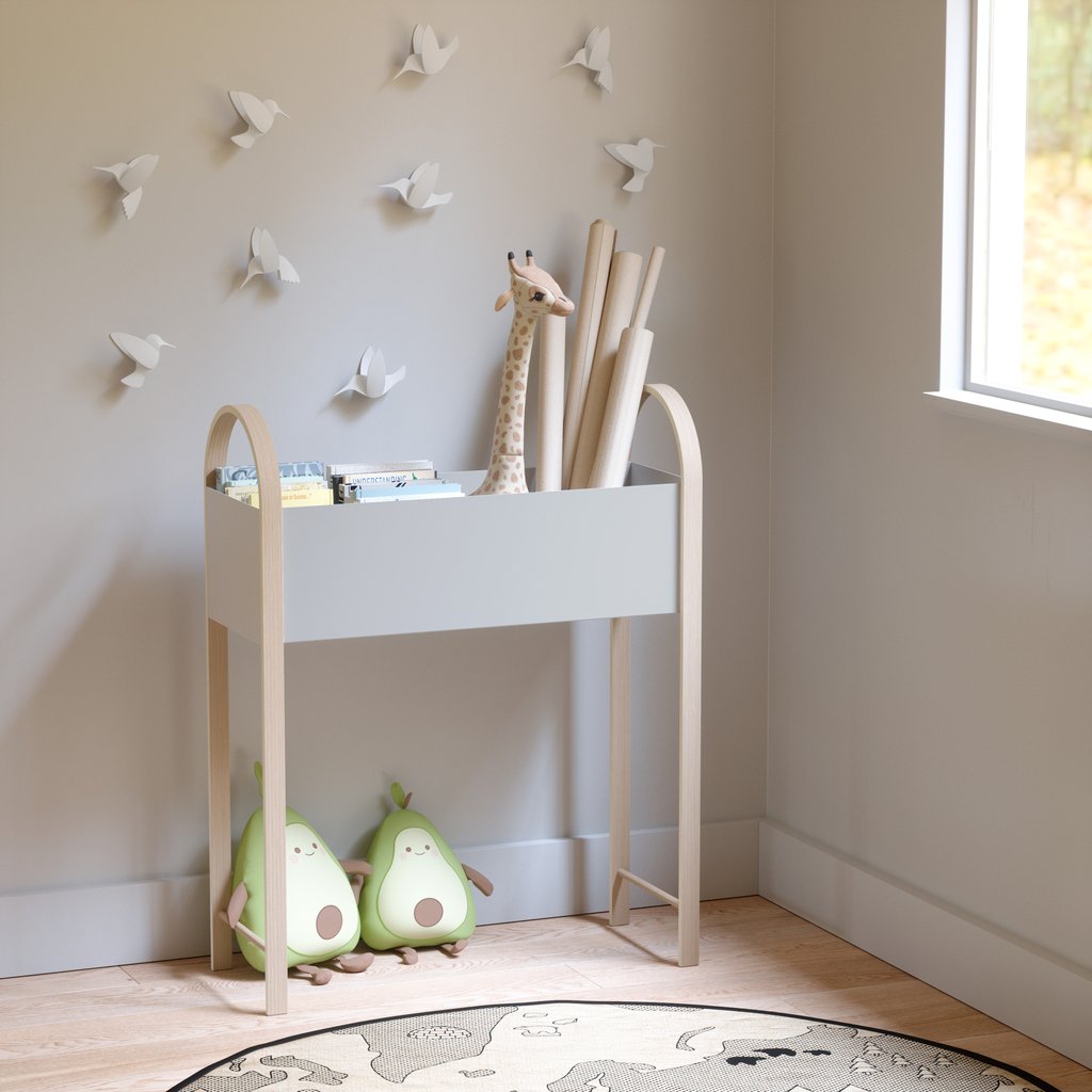 A child's room filled with a variety of Umbra stuffed animals, including a cuddly teddy bear.