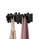 An Umbra wall coat rack with flip-down hooks for home organization, called the Sticks Multi Hook - Black.