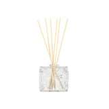 A clear FLWR Diffuser - Fleur D'Oranger by The Aromatherapy Co with aromatic grapefruit and orange blossoms.