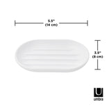 An Umbra Touch Soap Dish with rounded edges made of white oval shape.