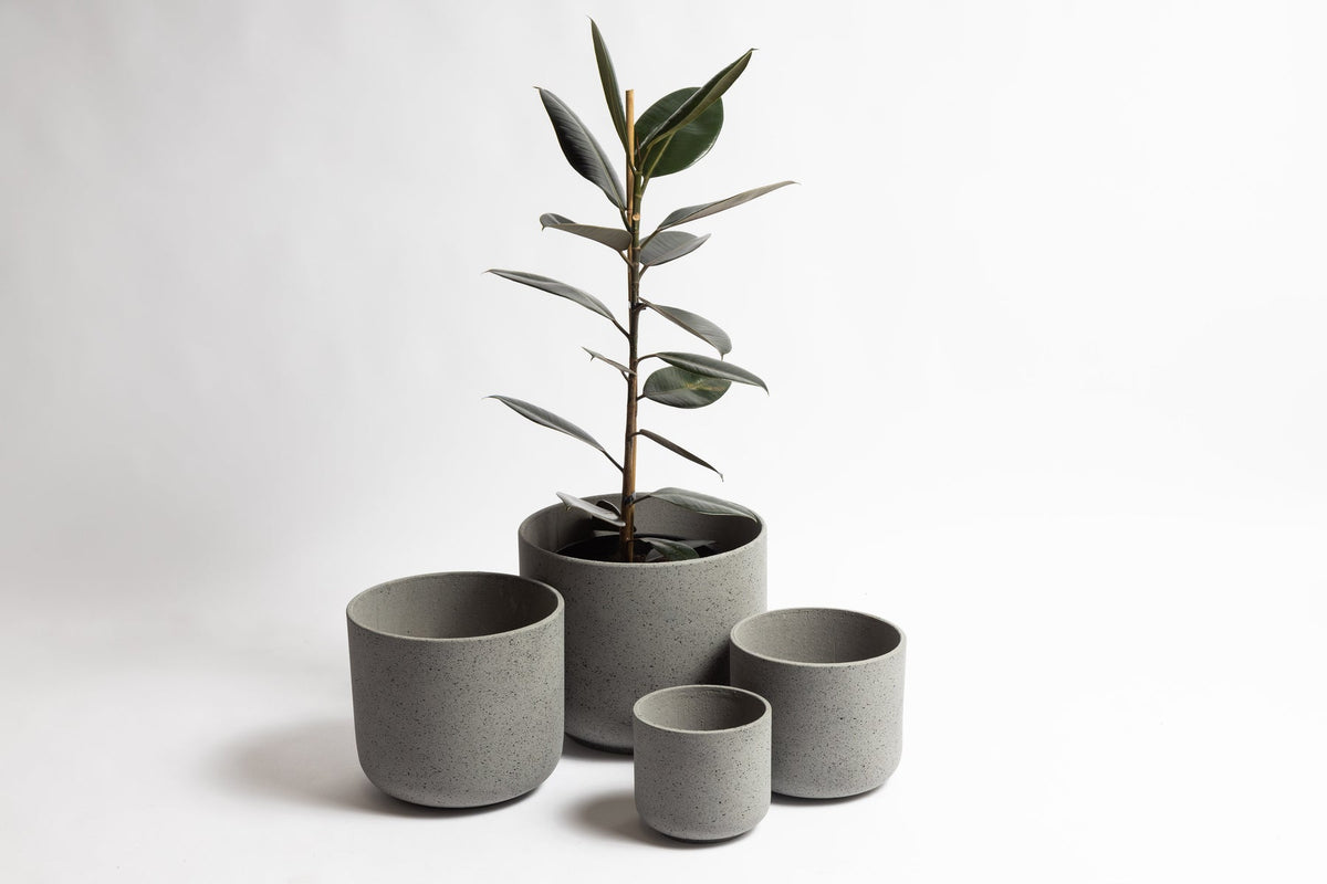 Rustie Pot Set clustered on a patio