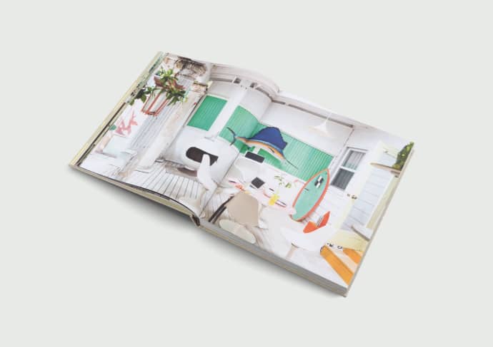 Surf Shacks Volume 2 open to a spread of colourful interiors