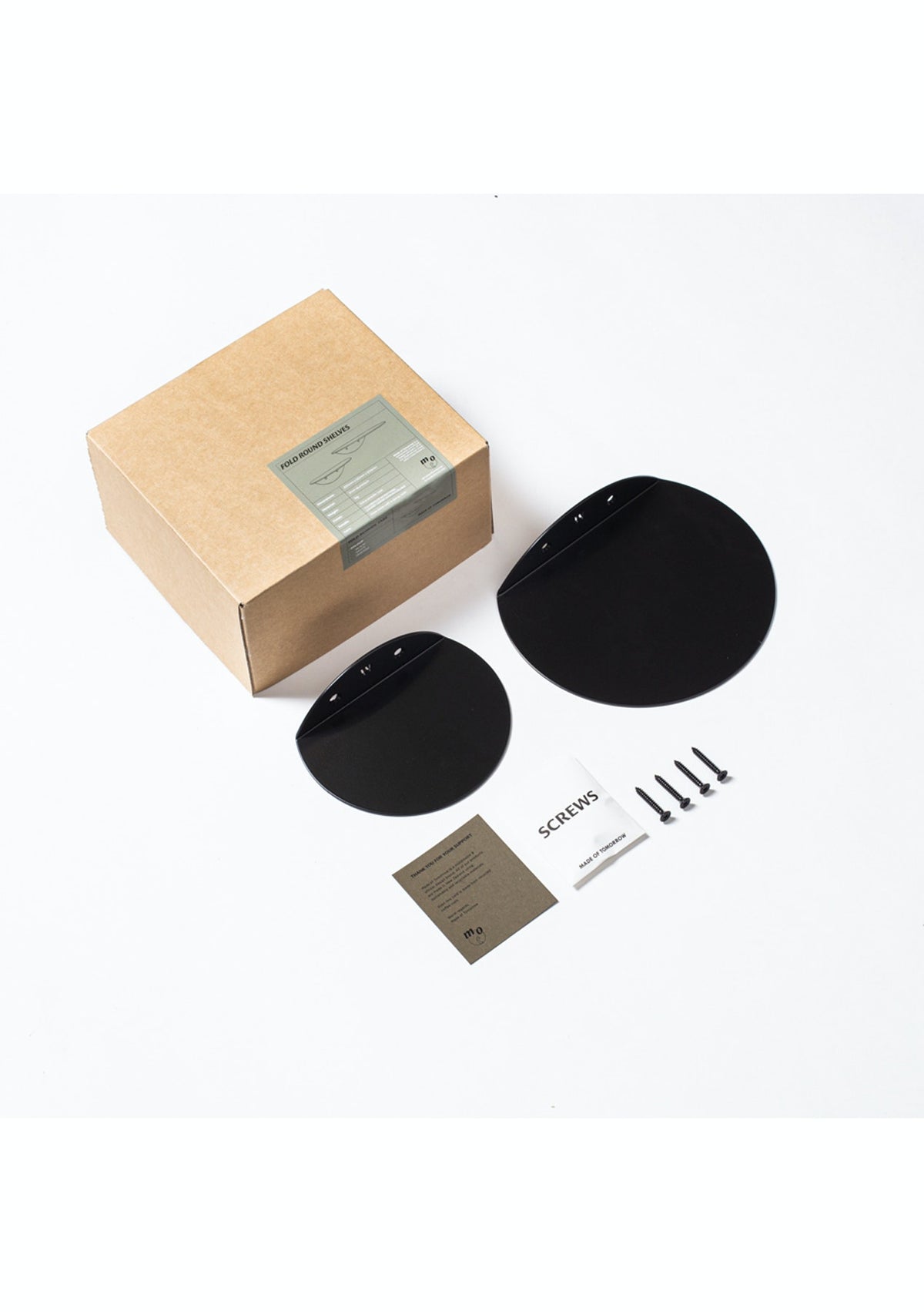FOLD Round Shelves box contents: two black round shelves, screws and instructions