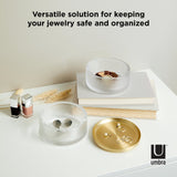 Upgrade your jewelry organization with the modern design of Umbra Tesora Storage Box, a sleek storage solution for keeping your precious pieces safe and organized.