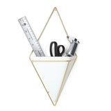 A modern design Trigg Wall Vessel - Black by Umbra, triangle shaped wall hanging with a ruler and scissors, adding a decorative touch.