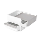 An Umbra STOWIT MINI JEWELRY BOX WHT/NKL with two hidden compartments open on a white surface.