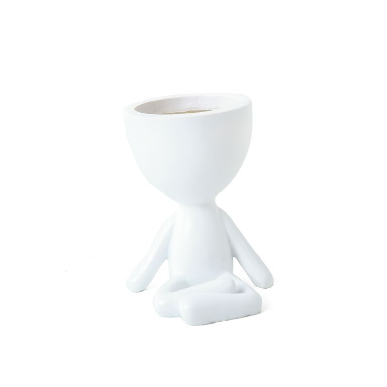 White egg head planter shaped as a seated cross-legged figure with a bowl for a head, on white