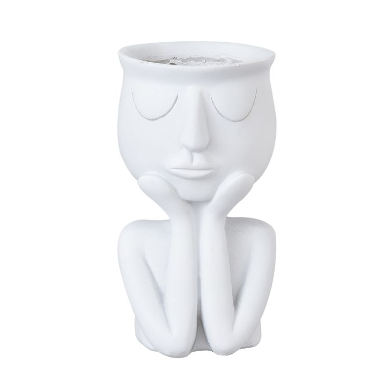 White face planter shaped as a seated figure resting its chin on its hands, the open bowl forming the head