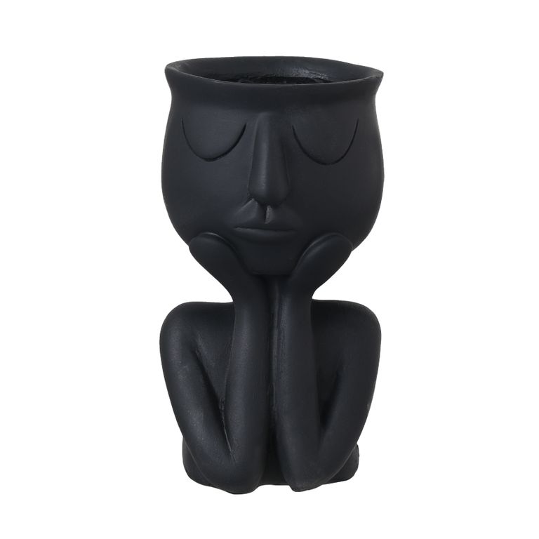 Black face planter in the same seated pose, chin resting on hands with the planting bowl on top