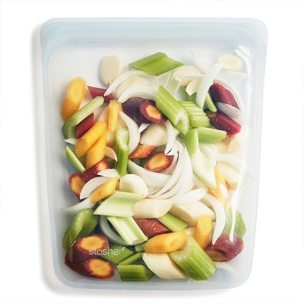 A Stasher HALF GALLON BAG - CLEAR with an airtight seal filled with vegetables and fruit.