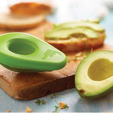 A SET OF 2 - AVO SAVERS from Food Huggers sit on a cutting board.