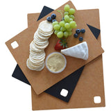 A Dishy CHOPPING BOARD - Black with grapes and crackers on it.