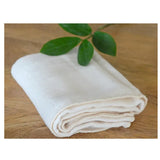 An ORGANIC FACE TOWEL with a leaf on it by Nawrap.