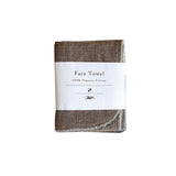 A brown cloth with the words Nawrap Organic Face Towel on it.