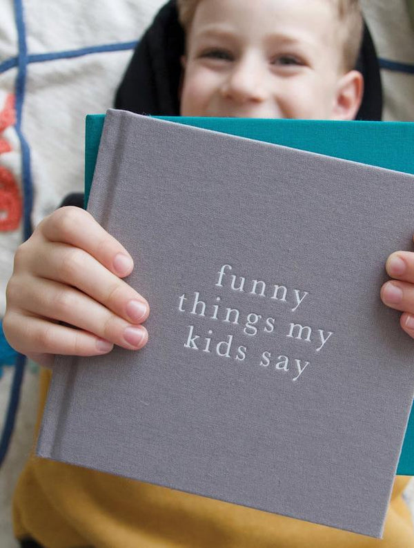 A Write To Me journal filled with hilarious quotes from my kids called Funny Things My Kids Say GREY.