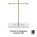 The Umbra TRIGEM JEWELRY STAND - BRASS features an integrated accessory dish, perfect for holding necklaces and keeping them tangle-free.