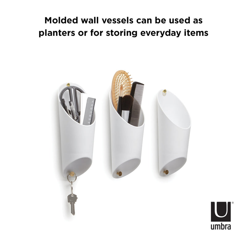 The Umbra range offers versatile molecular vessels that can be used as planters or for storing everyday items. These unique Umbra Floralink wall vessels are perfect for creating a DIY green wall in any space.