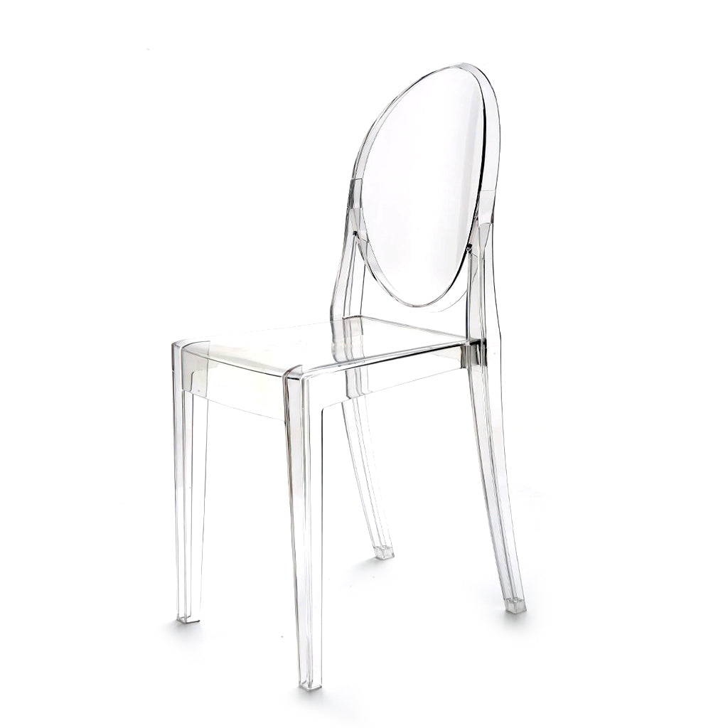 Clear acrylic dining chair with an oval back and square seat, angled to the rear on white