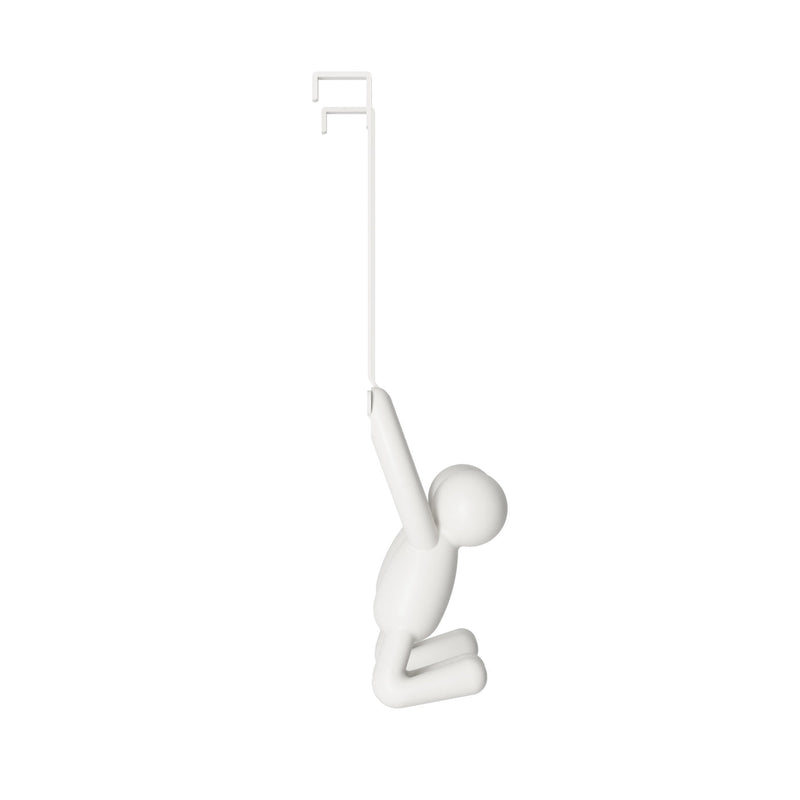 A BUDDY OVER THE DOOR HOOK WHITE figurine hanging from an Umbra Over the Door Double Hook on a white background.