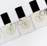 Gypsy roll-on perfume oil bottles lined up on a white surface, showing the slim 10ml glass design from Flux Boutique