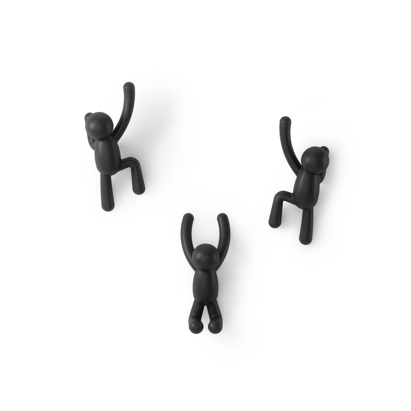 Three Umbra black monkeys hanging on a Buddy Hooks Black - Set of 3 coat rack.