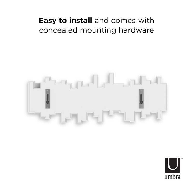 A white Umbra wall with the words "easy to install" with connected mounting hardware for efficient home organization featuring the Sticks Multi Hook - White.