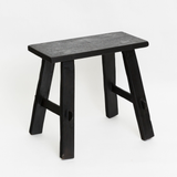 A small Flux Home Teak Bench in Black on a white background.