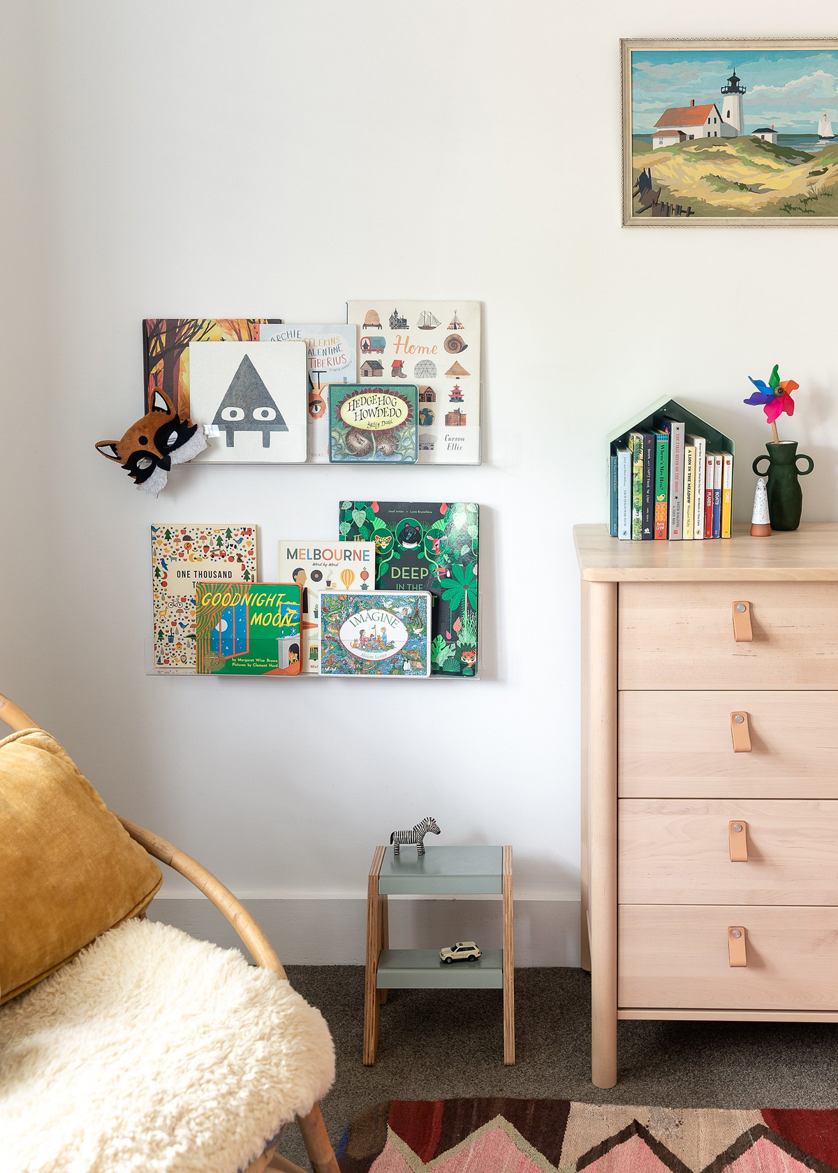 A "Our Spaces - Contemporary New Zealand Interiors" wooden dresser in a child's room.