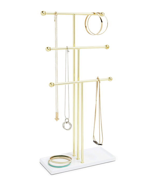 An Umbra TRIGEM JEWELRY STAND displaying a selection of necklaces, providing a tangle-free solution for necklace organization.