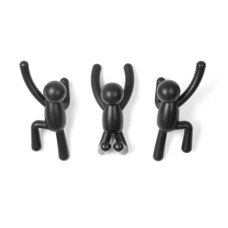 Three black plastic Umbra Buddy Hooks hanging on a white background.