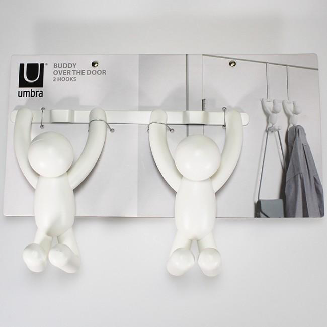 Umbra Buddy double hook with two white figures, against a wall