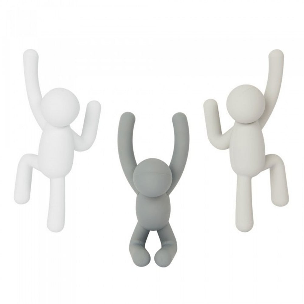 Three Umbra Buddy wall hooks in white and grey, figures in climbing poses