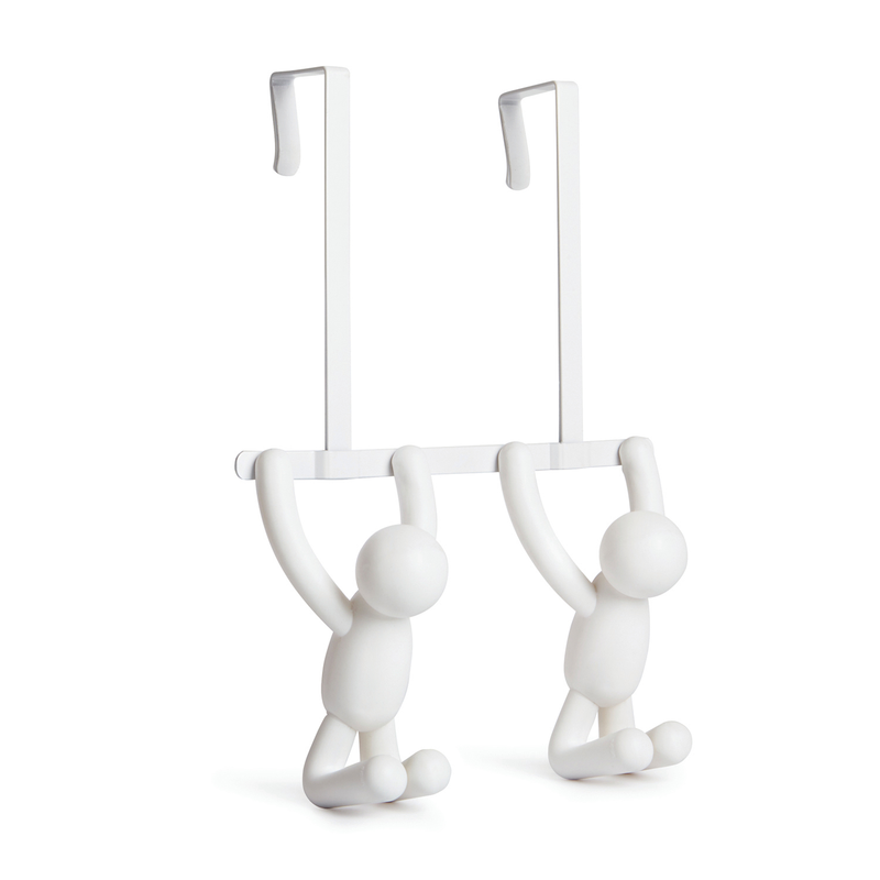 A pair of white plastic people hanging on a Buddy Over the Door Hook White by Umbra.