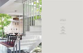 The interior of a house with stairs and a table featuring Resident Dog Volume 2 by Nicole England.