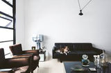 A living room with a Resident Dog Volume 2 | Nicole England book and a coffee table.