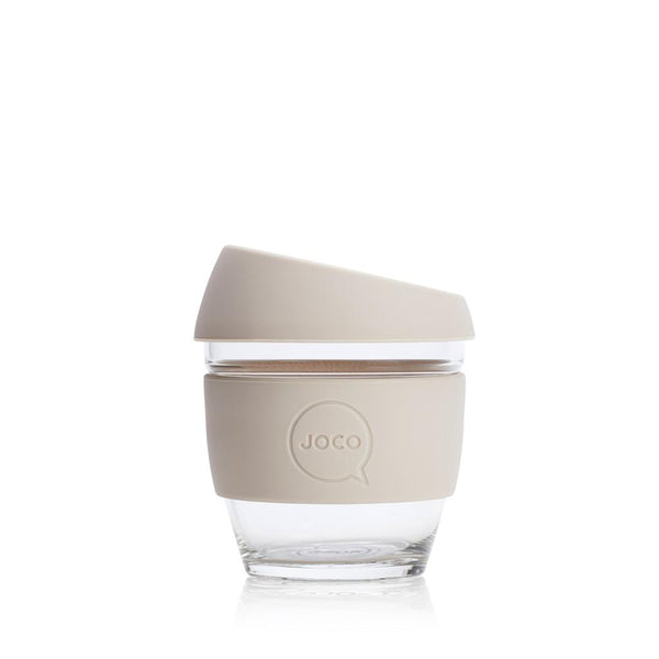 A Joco Cup with a lid on a white surface.